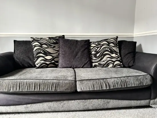 DFS Charcoal/black 3/4 seater sofa and large cuddle chair