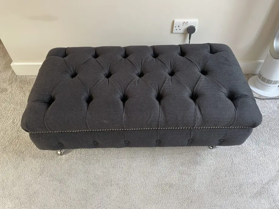 Dark grey two seater, snug chair and footstool
