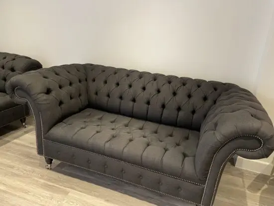 Dark grey two seater, snug chair and footstool