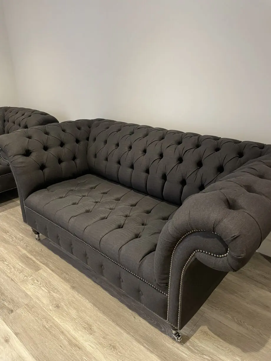 Dark grey two seater, snug chair and footstool