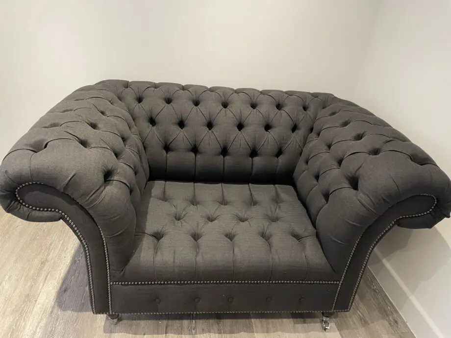 Dark grey two seater, snug chair and footstool