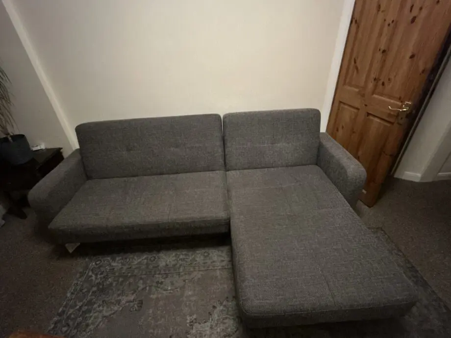 Grey Sofa bed with a chaise lounge