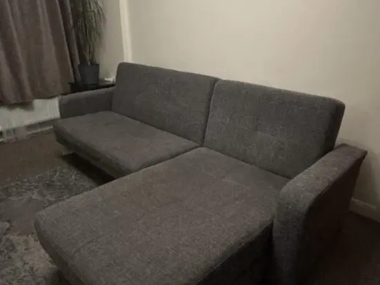 Grey Sofa bed with a chaise lounge