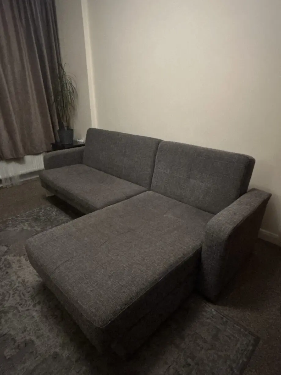 Grey Sofa bed with a chaise lounge