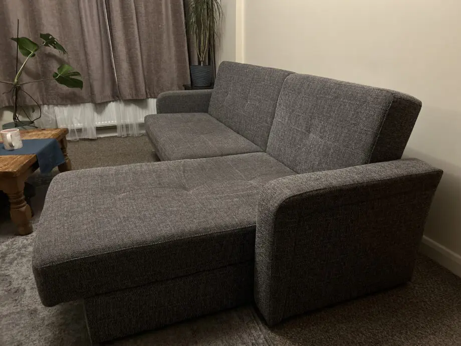 Grey Sofa bed with a chaise lounge