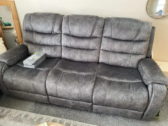 Grey three seater recliner