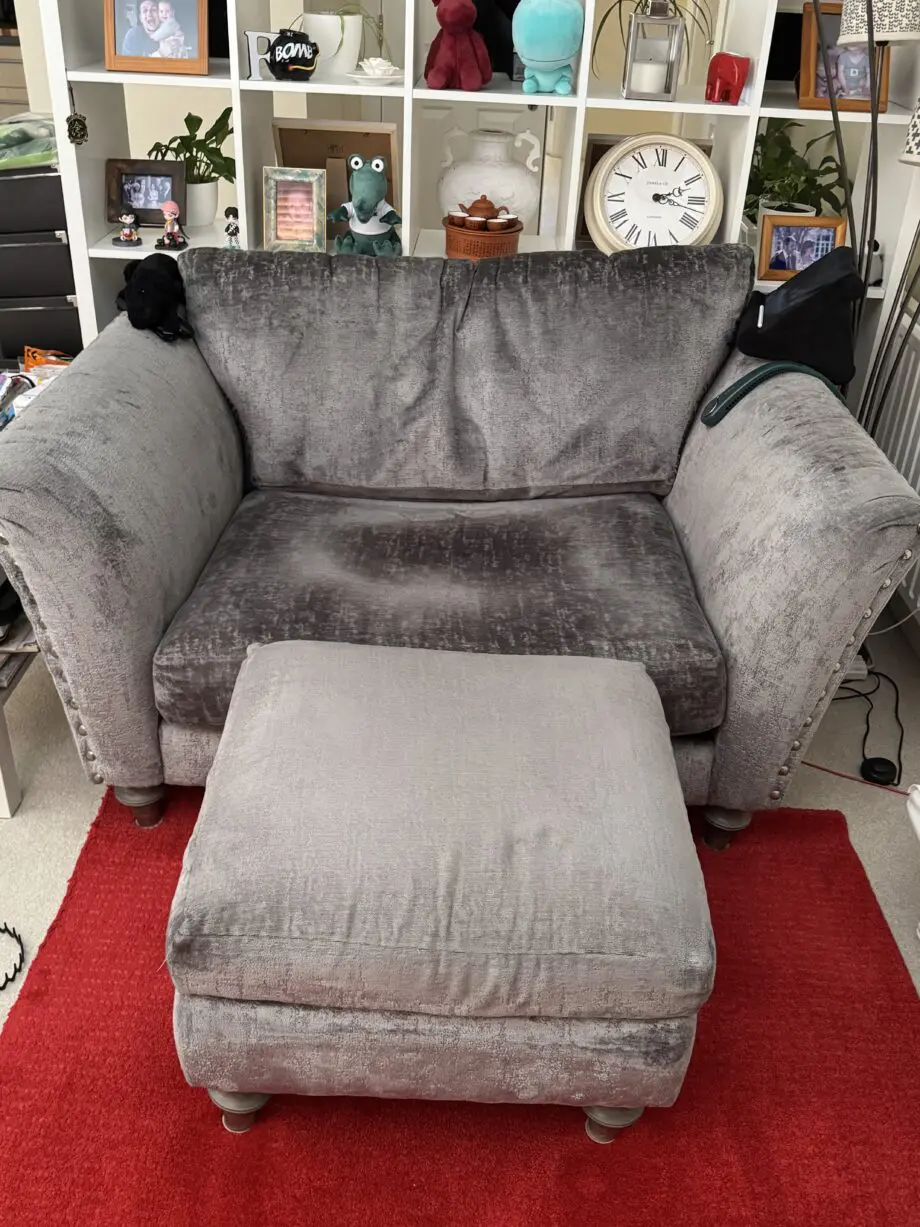 DFS Lawrie grey love armchair with matching ottoman