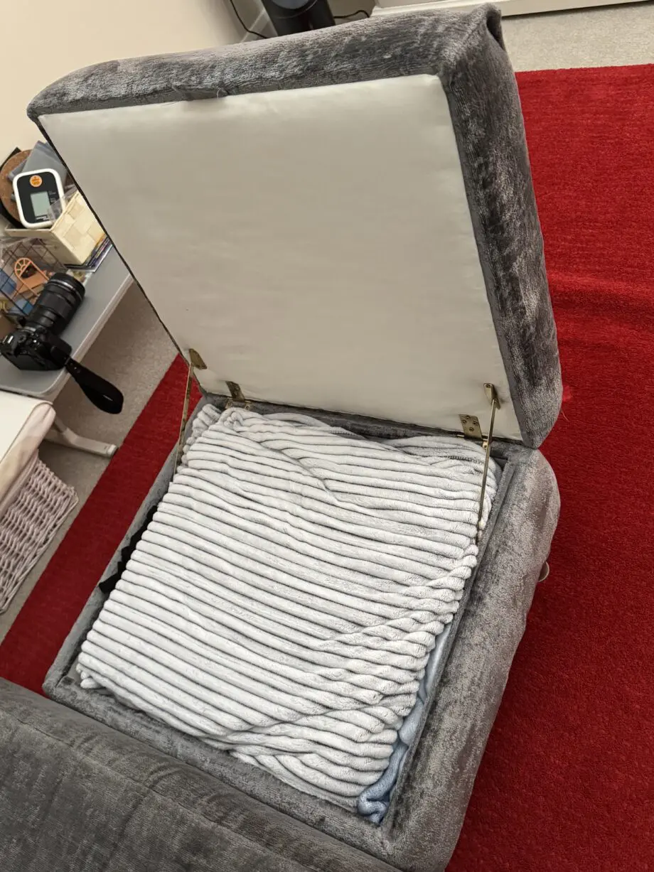 DFS Lawrie grey love armchair with matching ottoman