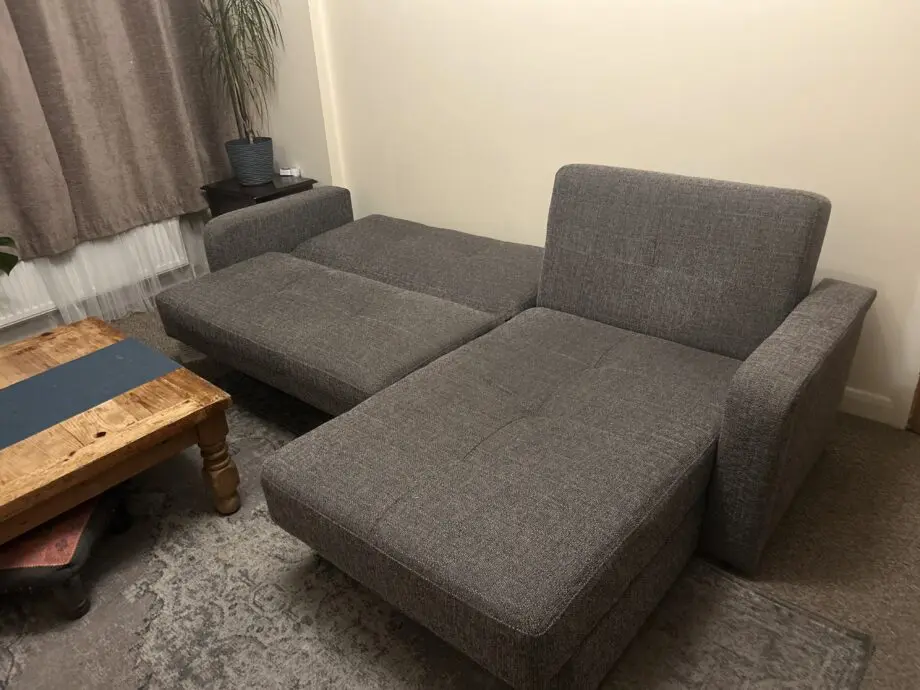 Grey Sofa bed with a chaise lounge