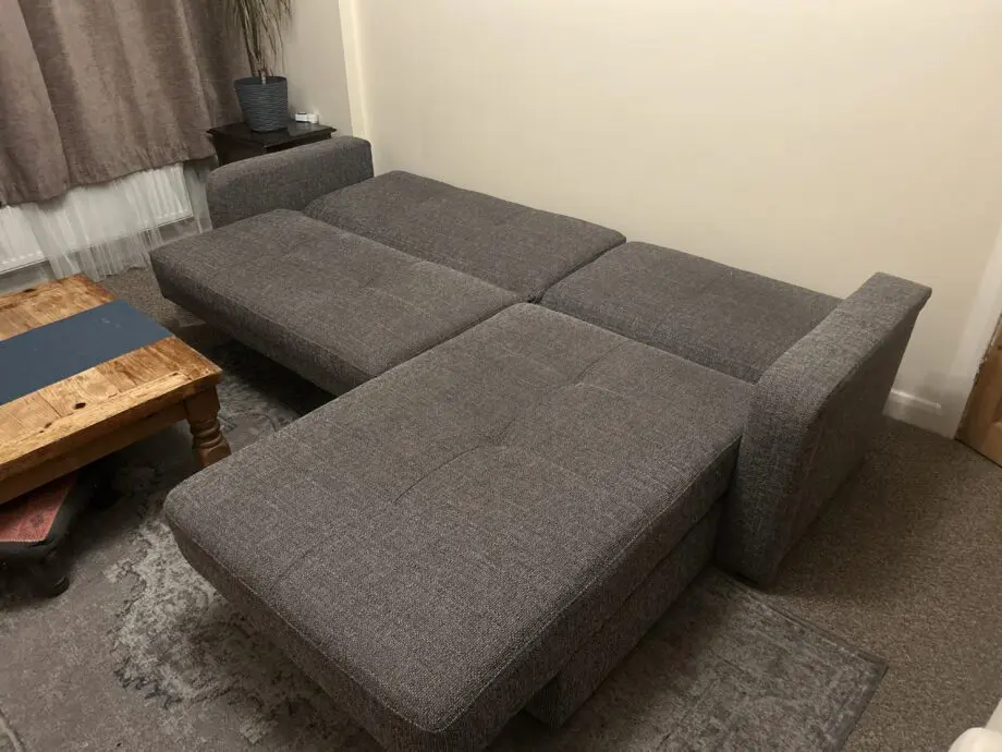 Grey Sofa bed with a chaise lounge