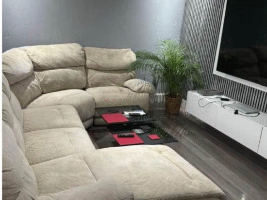 Corner sofa with recliner