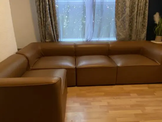 4-seater L-shaped brwon leather couch