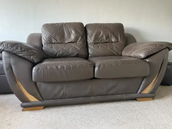 Two 2-seater brown leather sofas from DFS