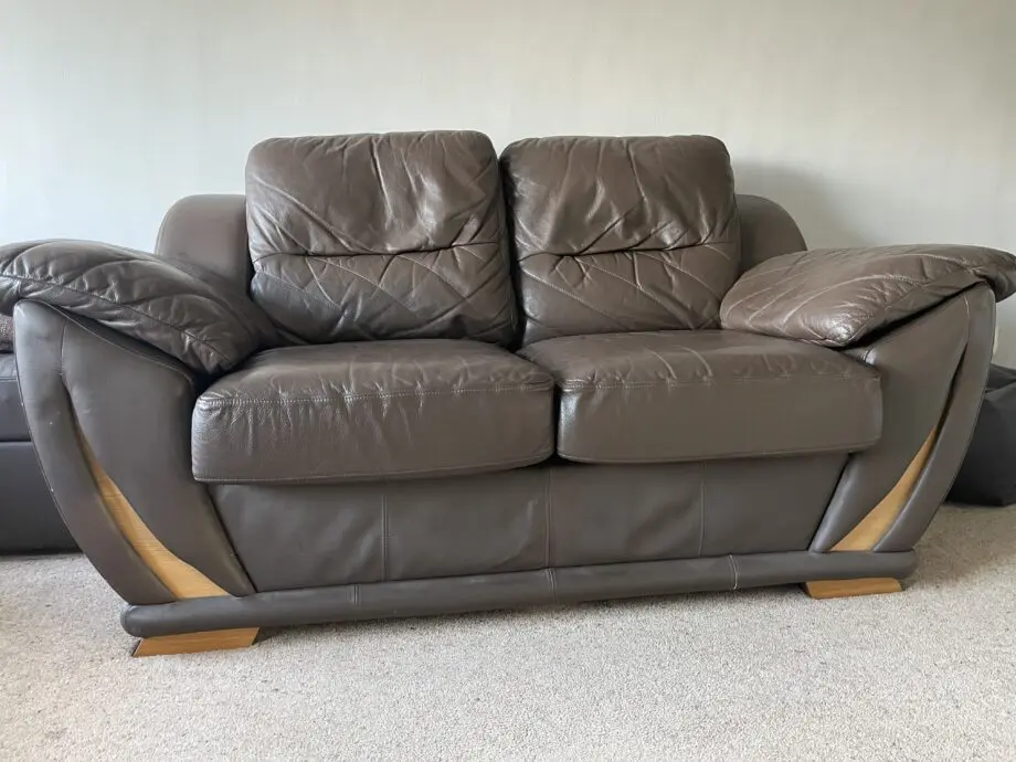 Two 2-seater brown leather sofas from DFS