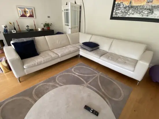Natuzzi corner sofa with arms at either end