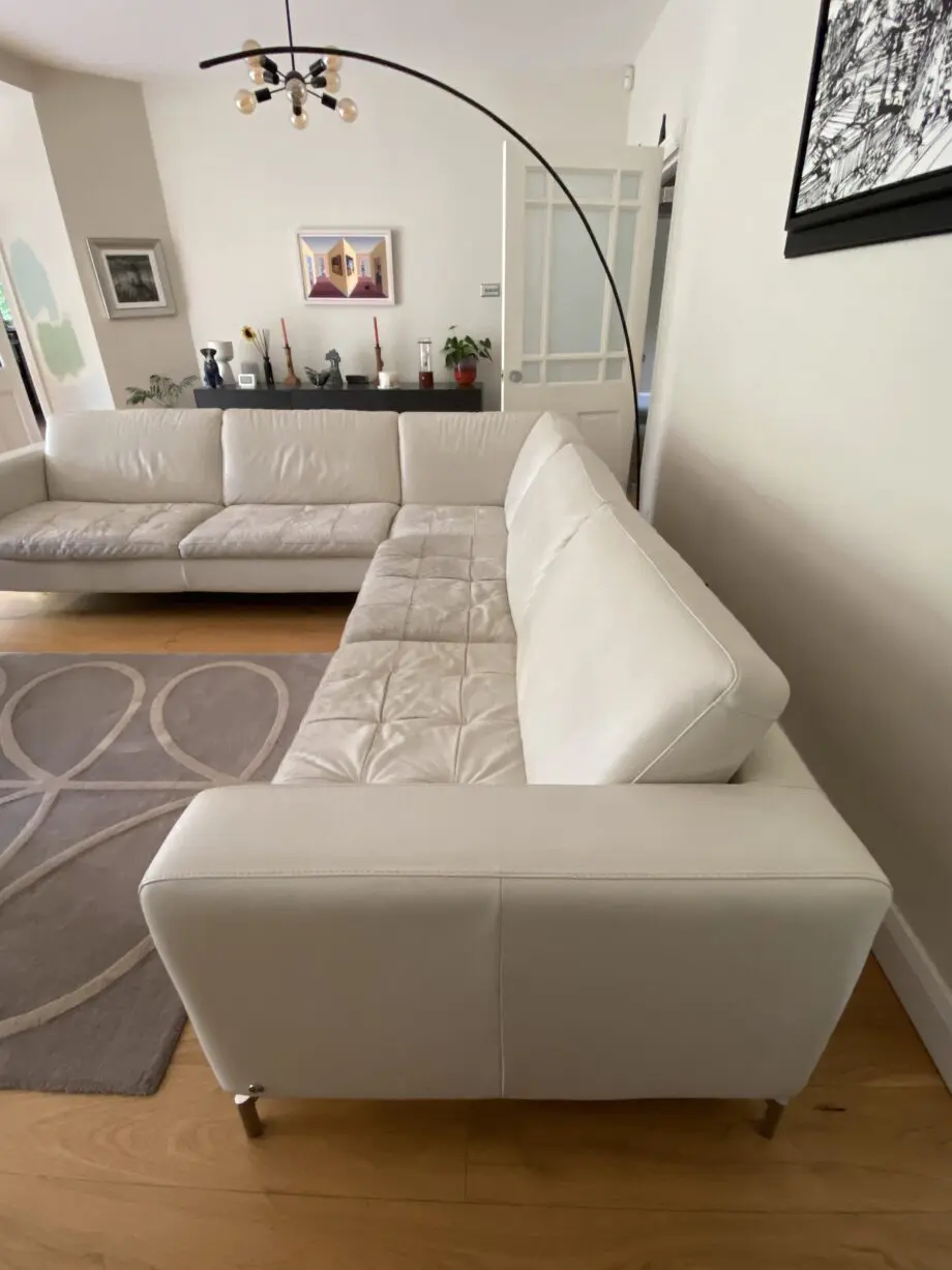 Natuzzi corner sofa with arms at either end