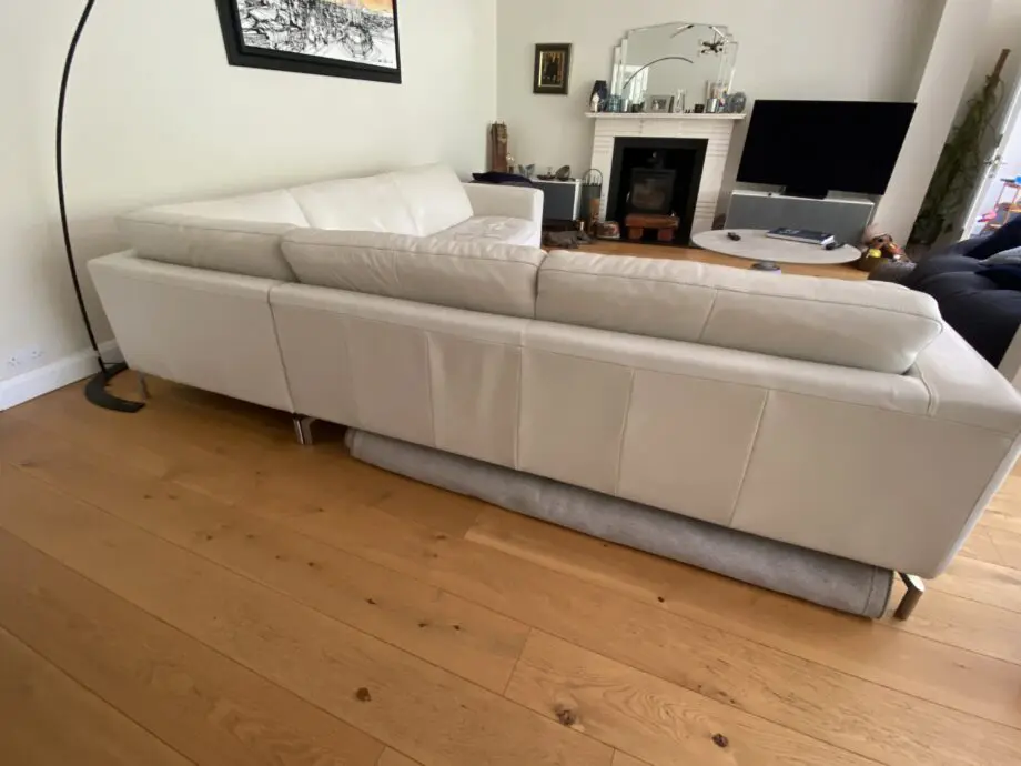 Natuzzi corner sofa with arms at either end