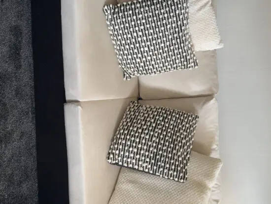 Black and white suede sofa and chair.