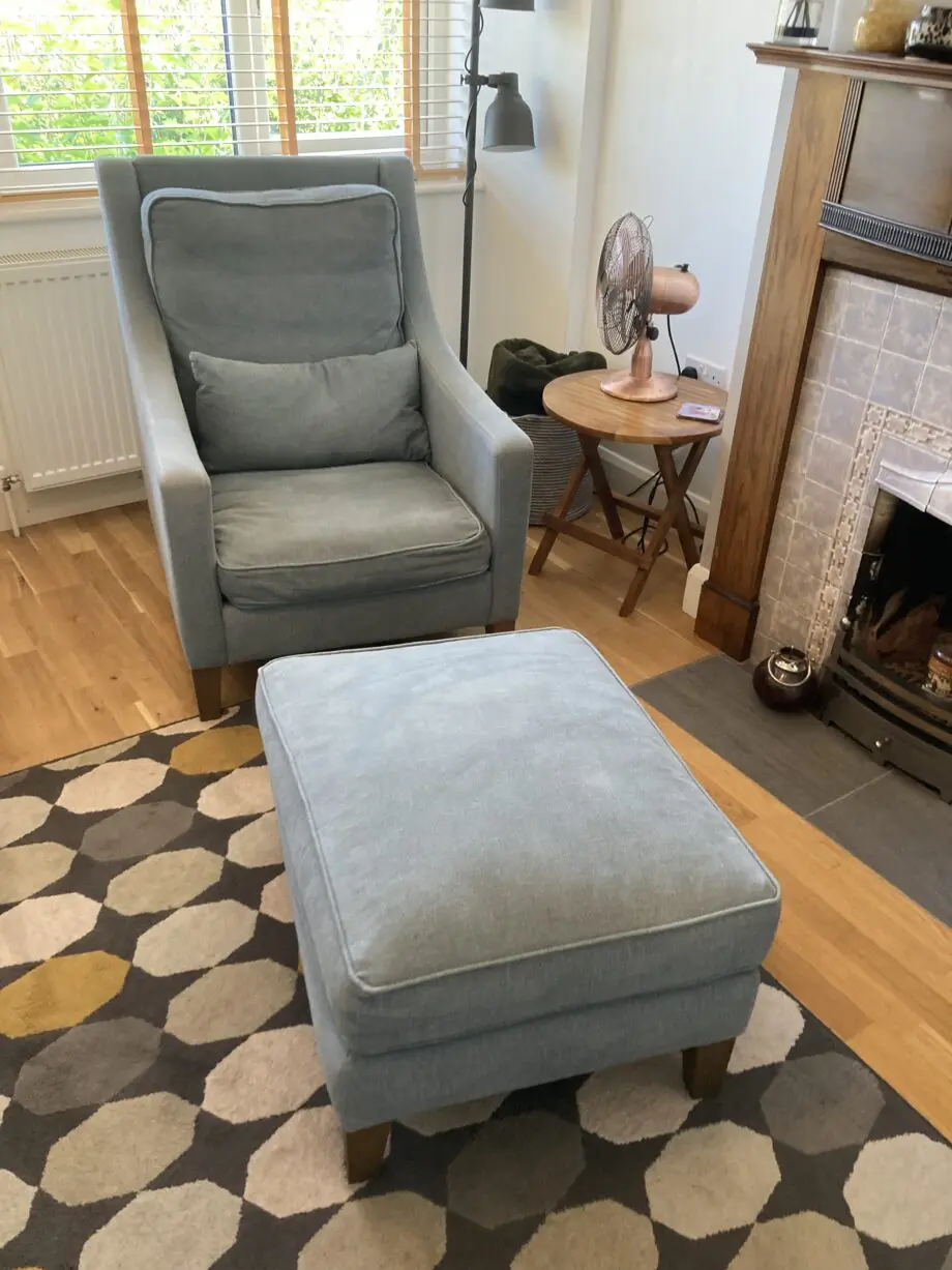 A up holstered high back easy Chair and matching foot stool