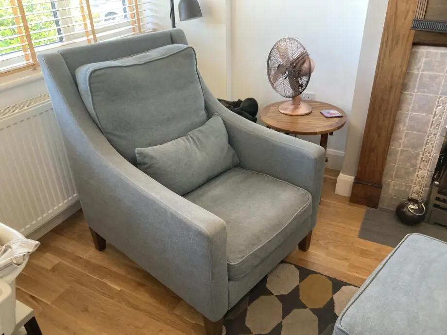 A up holstered high back easy Chair and matching foot stool
