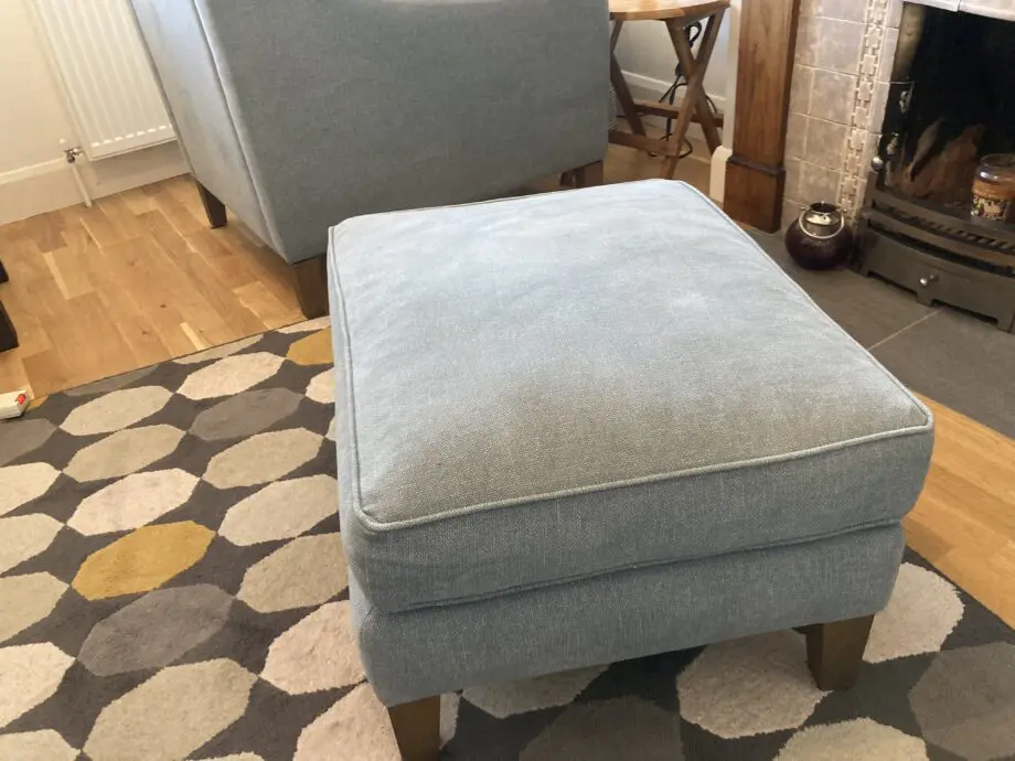 A up holstered high back easy Chair and matching foot stool