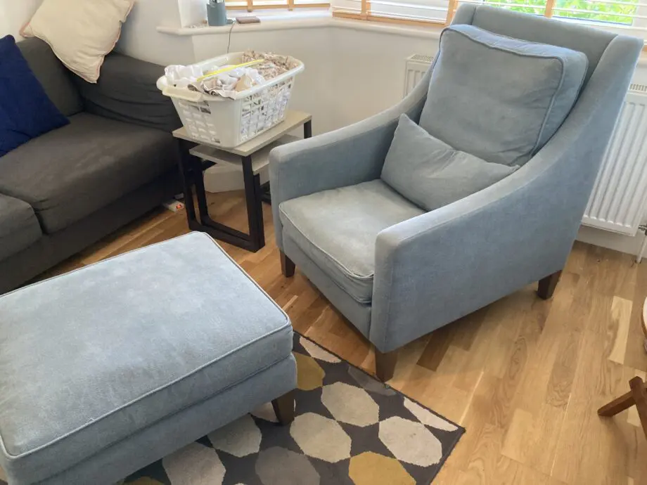 A up holstered high back easy Chair and matching foot stool