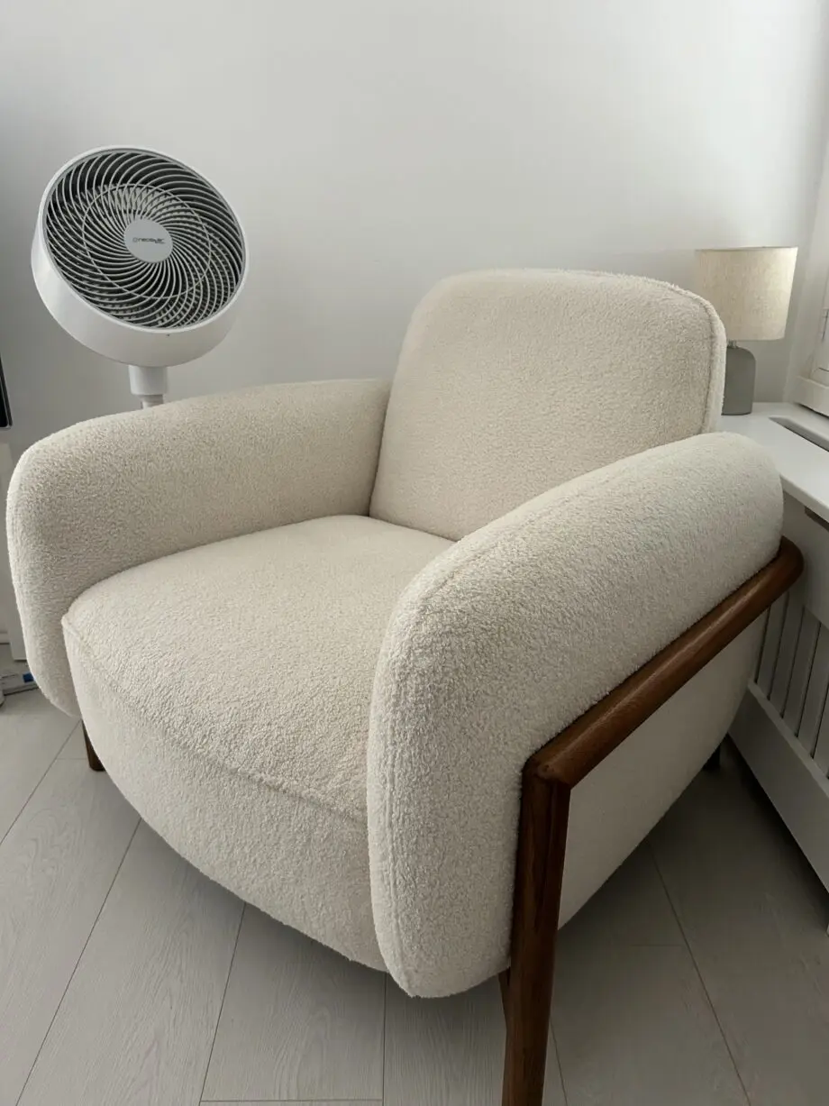 Firm, cream fabric armchair with solid wood frame