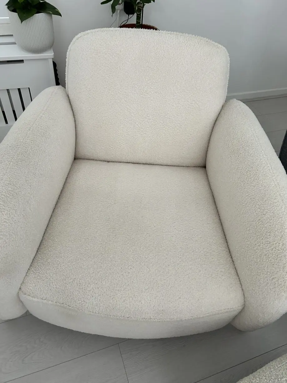 Firm, cream fabric armchair with solid wood frame