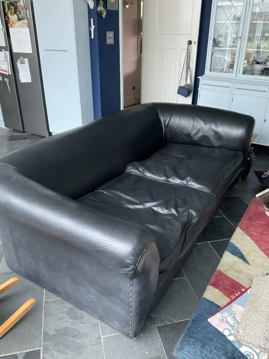 Black Leather HUGE sofa.