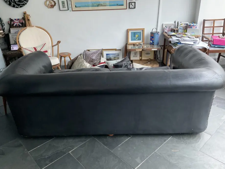 Black Leather HUGE sofa.