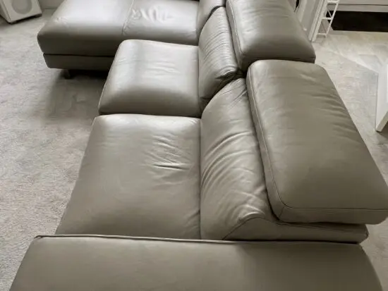Grey leather electric reclining sofa.