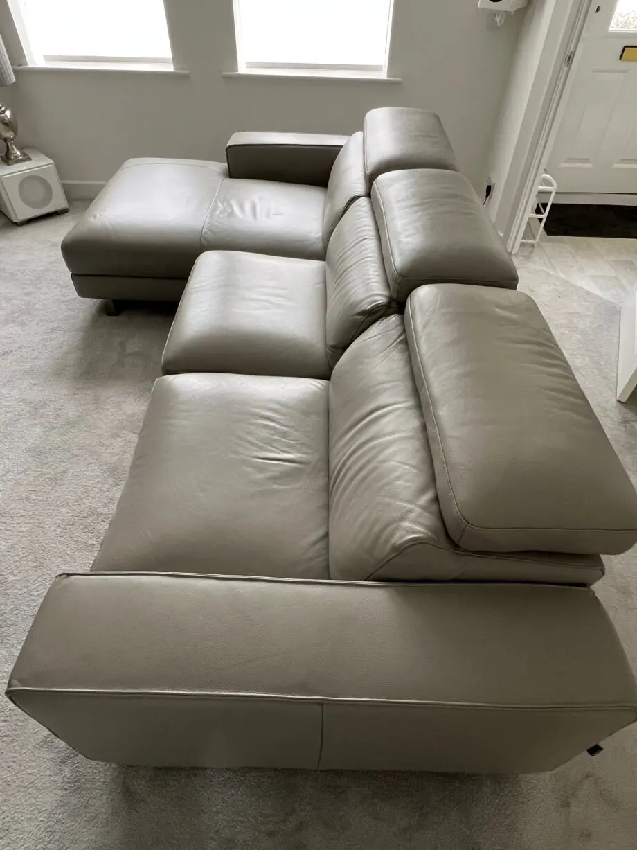Grey leather electric reclining sofa.