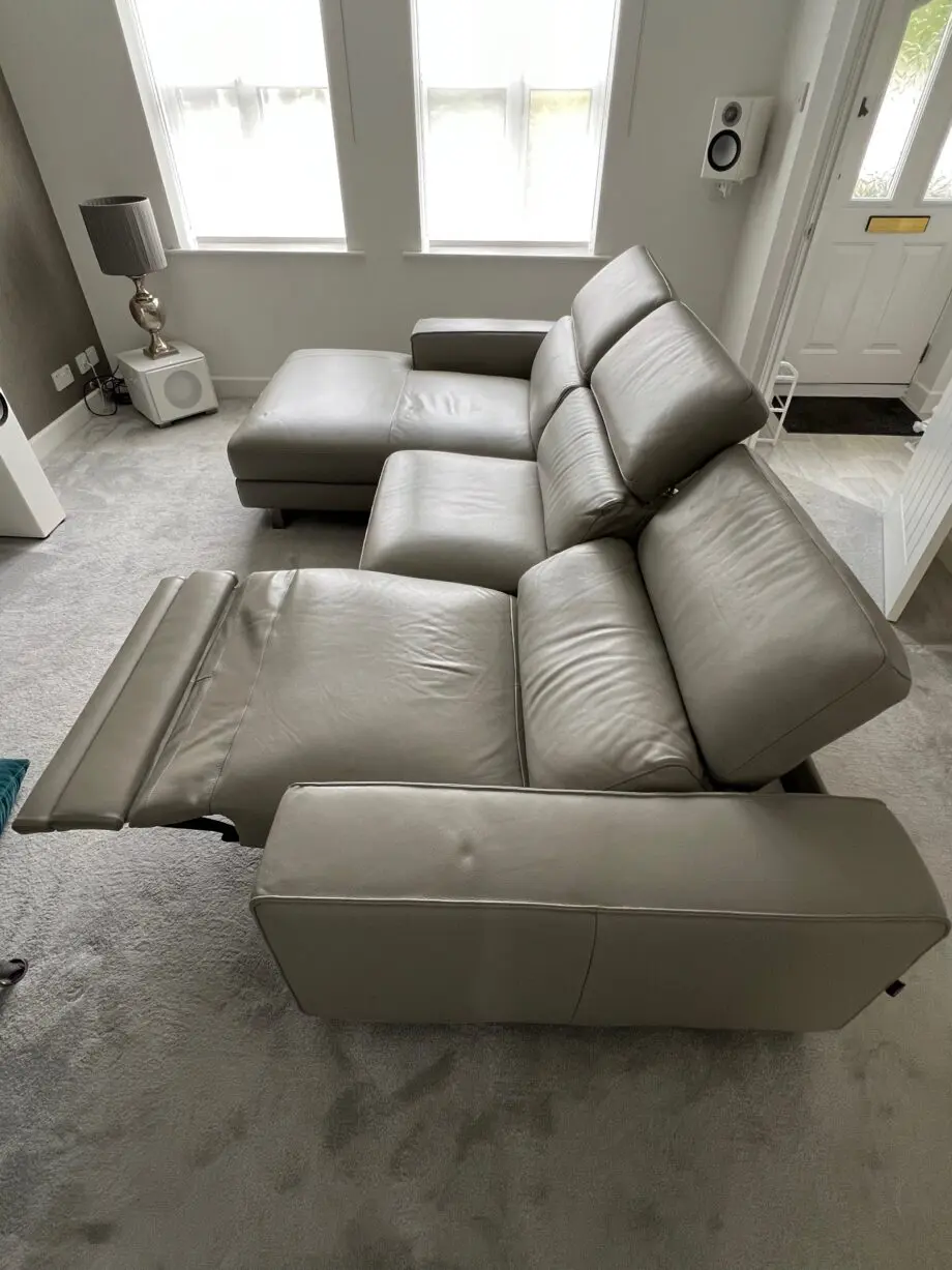 Grey leather electric reclining sofa.