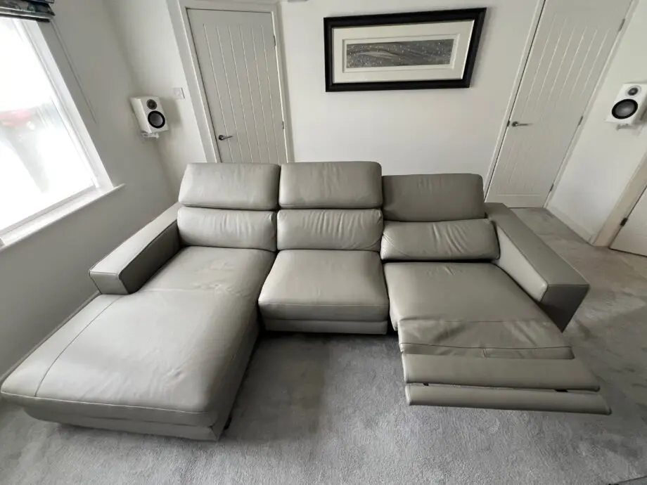 Grey leather electric reclining sofa.