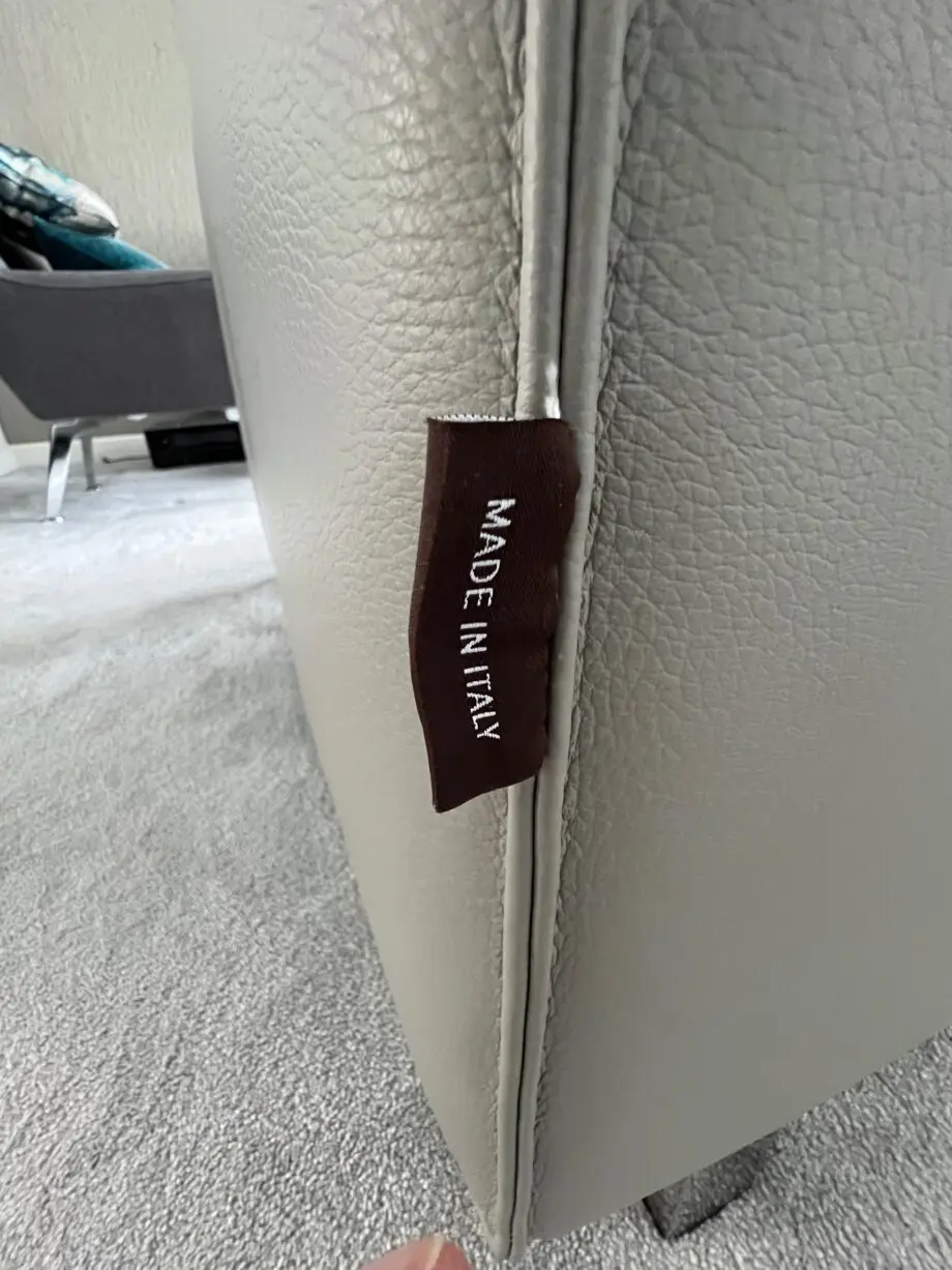 Grey leather electric reclining sofa.