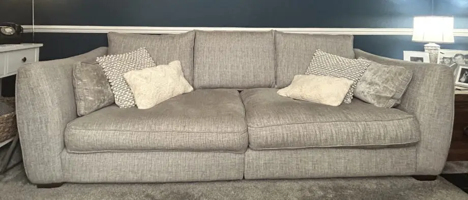 Sofology Grey 4-seater sofa with matching loose side cushions, snuggle chair and footstool with storage