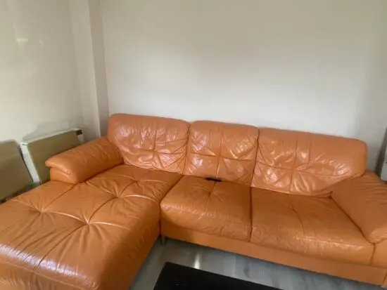 DFS leather sofa orange colour