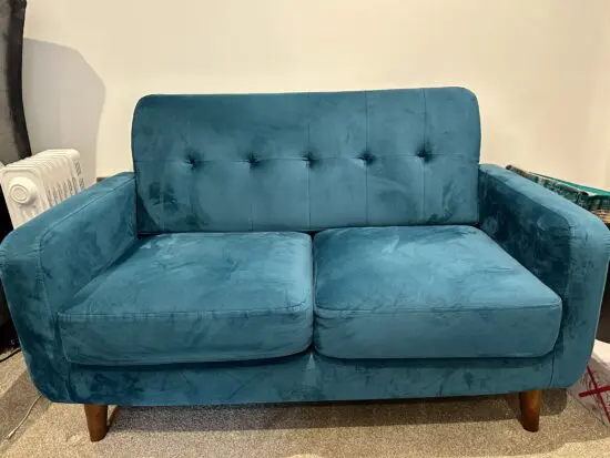 Teal coloured Casa Maria Designs two seater sofa in excellent condition