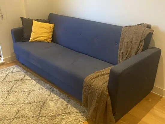 MADE Chou sofa bed - click clack 3 seater sofa. Navy blue with storage.