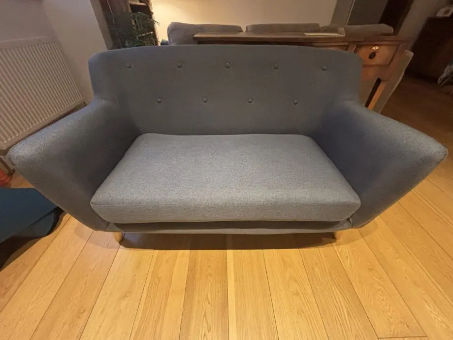 Two seat navy blue sofa