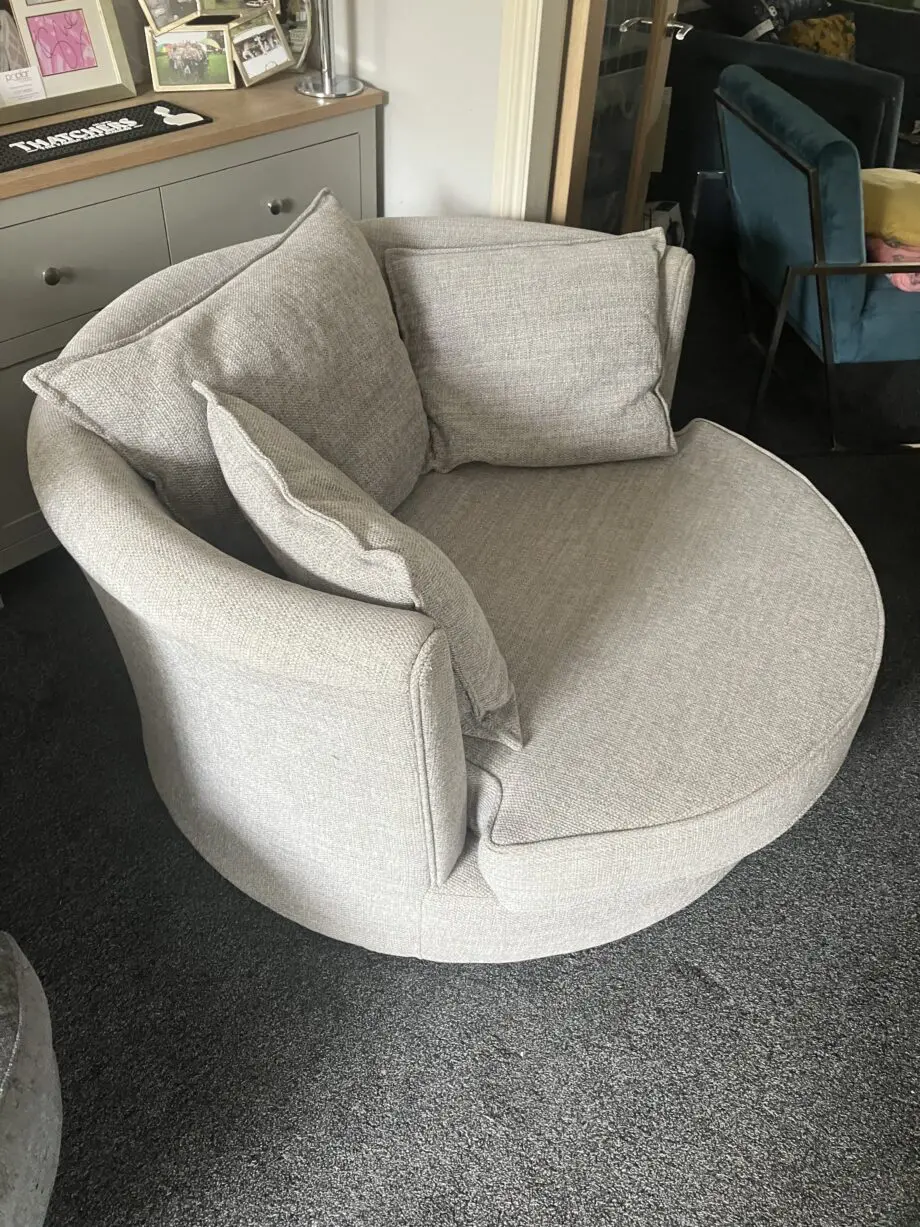 DFS Grey swivel love chair