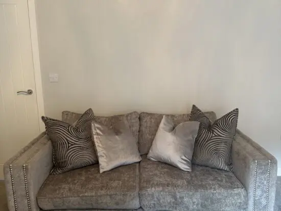 Two 3 seater grey Midas Sofology sofas with cleaning kit included