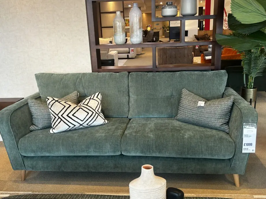 Furniture Village green sofa