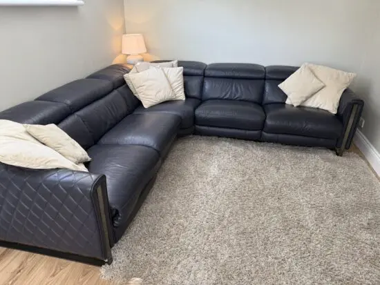DFS Navy leather reclining corner sofa