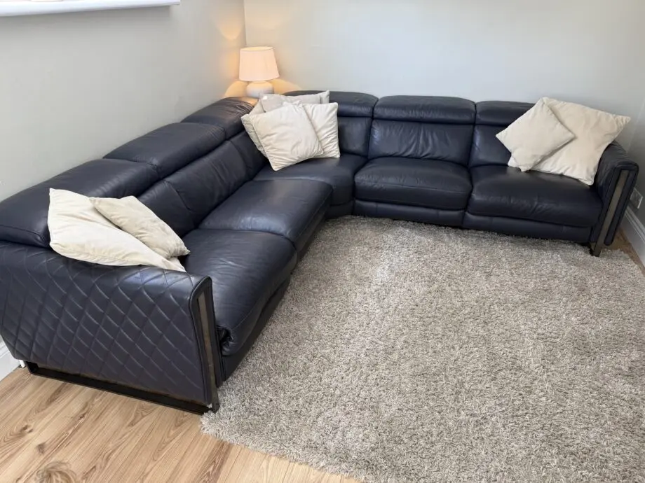 DFS Navy leather reclining corner sofa