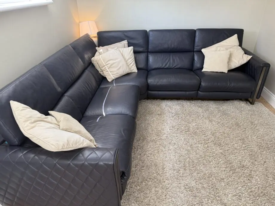 DFS Navy leather reclining corner sofa