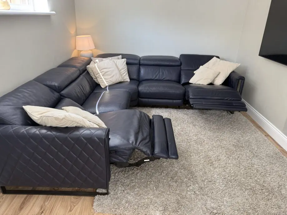 DFS Navy leather reclining corner sofa