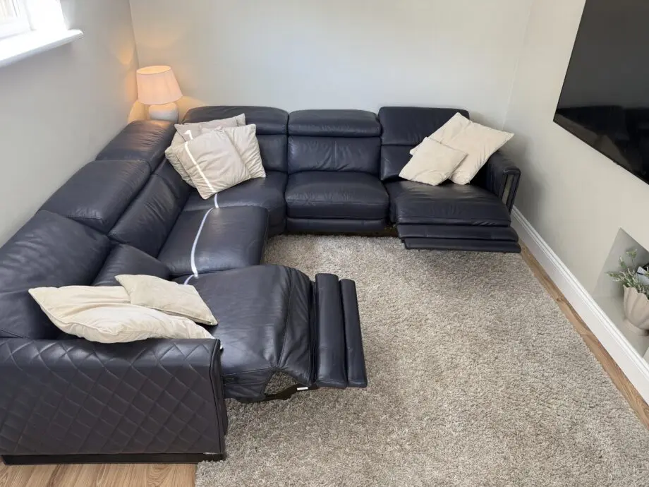 DFS Navy leather reclining corner sofa