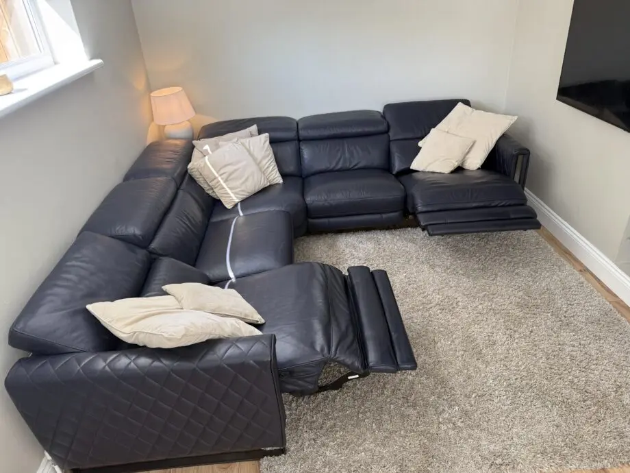 DFS Navy leather reclining corner sofa