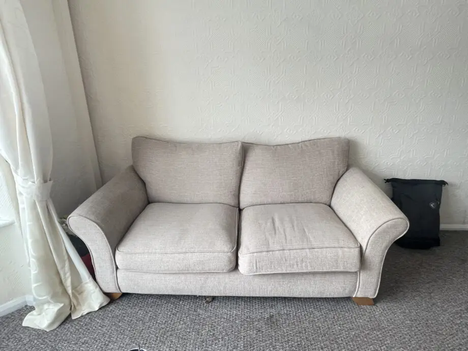Cream 2 seater sofa